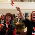 Supporters of the Forever Canadian group, who want Alberta to remain in Canada, wave Canadian flags as they watch the results of a non-binding referendum on Alberta sovereignty in Edmonton, Alberta, Canada October 19, 2026. REUTERS/Todd Korol