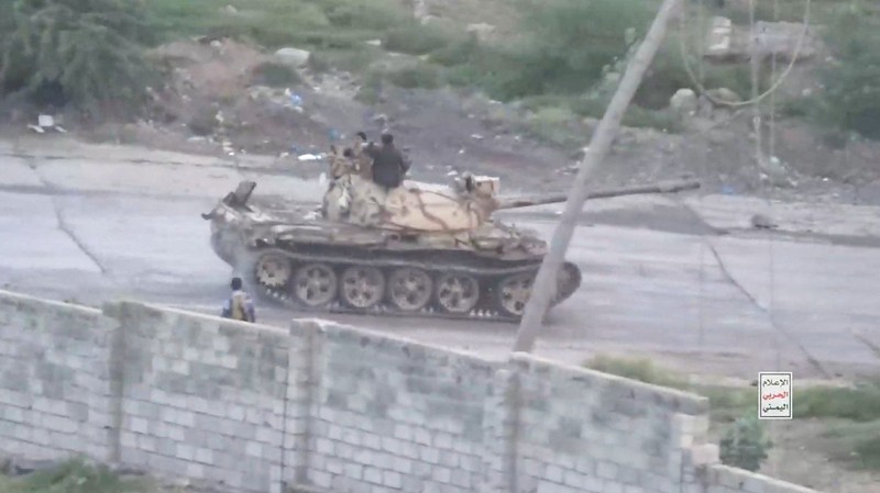 Members of Houthi military stand next to ordnance sitting on a hill amid what Houthi Military Media says are clashes between Houthi fighters and Saudi-backed Yemeni government forces in a location given as Taiz, Yemen, in this screengrab from a video released October 20, 2026. Houthi Military Media/Handout via REUTERS