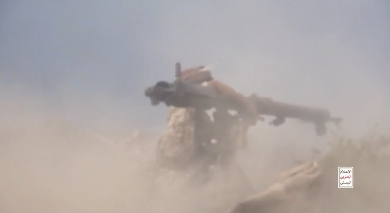 Members of Houthi military stand next to ordnance sitting on a hill amid what Houthi Military Media says are clashes between Houthi fighters and Saudi-backed Yemeni government forces in a location given as Taiz, Yemen, in this screengrab from a video released October 20, 2026. Houthi Military Media/Handout via REUTERS