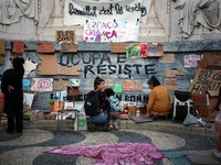 People at a protest camp Rossio square against house crisis and cost of living, in Lisbon, Portugal, October 19, 2026. REUTERS/Pedro Nunes
