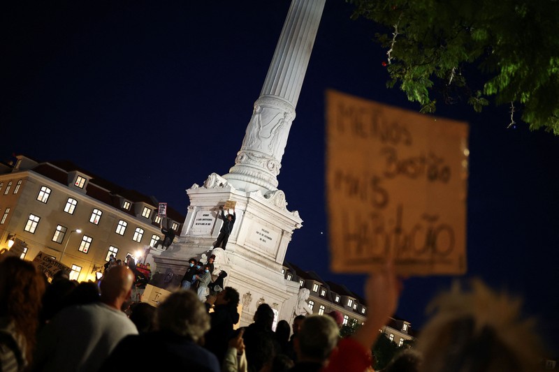 People at a protest camp Rossio square against house crisis and cost of living, in Lisbon, Portugal, October 19, 2026. REUTERS/Pedro Nunes