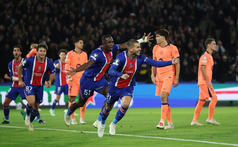 Soccer Football - UEFA Champions League - Paris St Germain v FC Barcelona - Parc des Princes, Paris, France - October 20, 2026  Paris St Germain's Desire Doue celebrates scoring their first goal REUTERS/Stephane Mahe