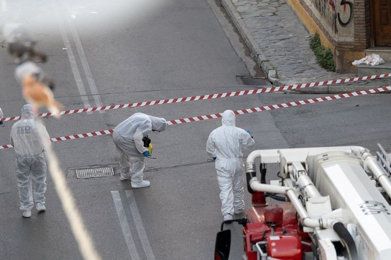 Police tape cordons off the site, following an explosion at a building in central Athens, in which police officers and members of the public were injured, in Athens, Greece, October 21, 2026. REUTERS/Stelios Misinas