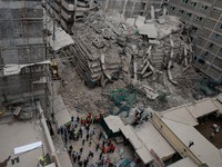 Emergency personnel work at the site of a building collapse in Eastleigh, Nairobi, Kenya, October 23, 2026. REUTERS/Monicah Mwangi   TPX IMAGES OF THE DAY