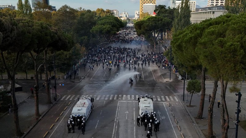 A drone view shows riot police officers deploying water cannons against demonstrators during an anti-government protest by students in Tirana, Albania, October 24, 2026. REUTERS/Fatos Bytyci