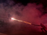 A demonstrator sets off a pyrotechnic device during an anti-government protest by students in Tirana, Albania, October 24, 2026. REUTERS/Valdrin Xhemaj