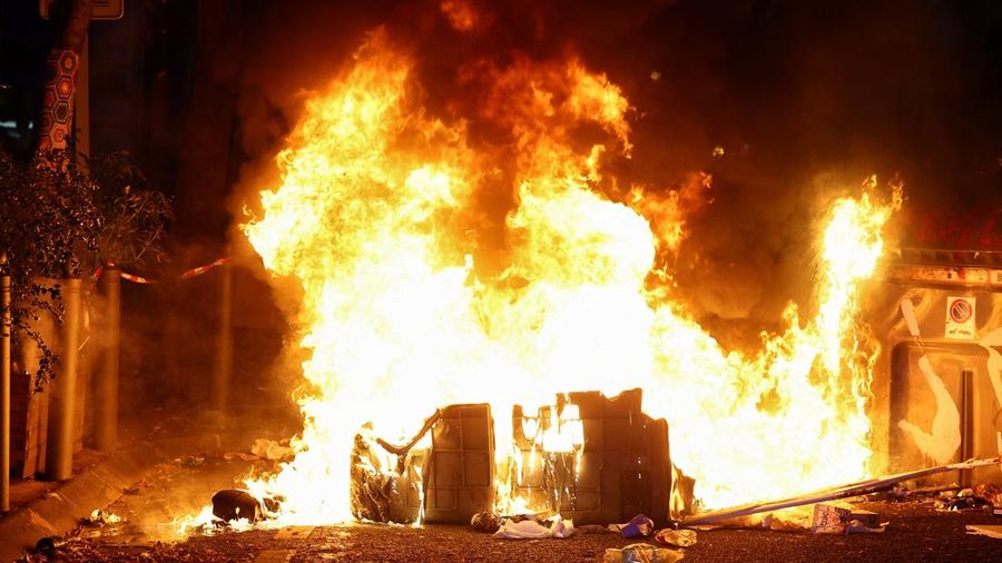 A fire burns during an authorised demonstration organised by a labour union in Marseille, France, October 24, 2026, as part of nationwide protests led by the "Yellow Vests" movement and joined by high school and university students. REUTERS/Manon Cru