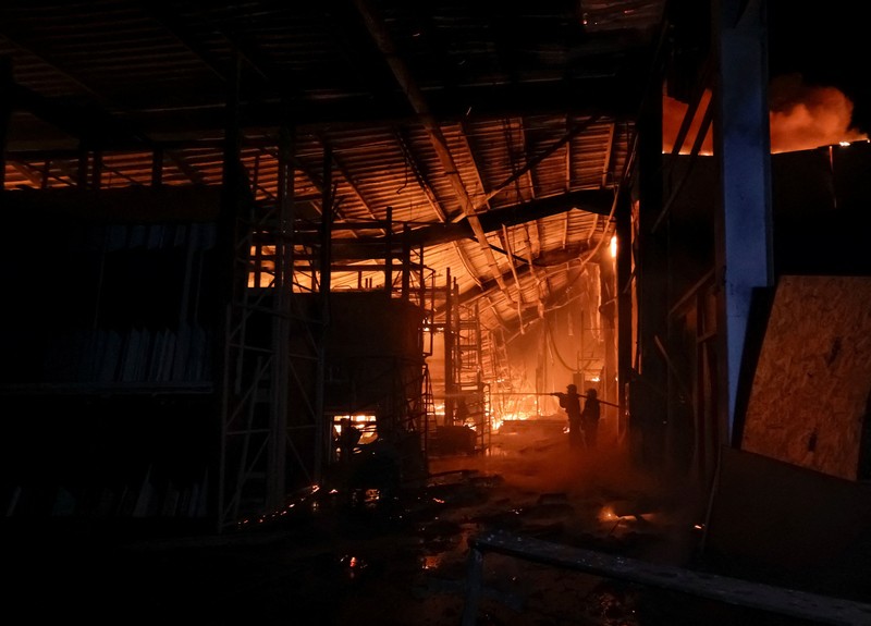 Firefighters work at the site of a household item shopping mall which was hit by Russian missile strikes, amid Russia's attack on Ukraine, in Kharkiv, Ukraine October 24, 2026. REUTERS/Sofiia Gatilova