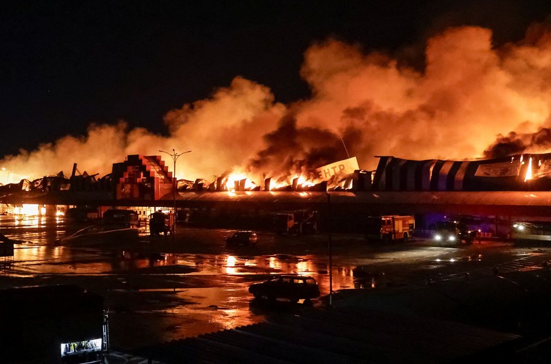 Firefighters work at the site of a household item shopping mall which was hit by Russian missile strikes, amid Russia's attack on Ukraine, in Kharkiv, Ukraine October 24, 2026. REUTERS/Sofiia Gatilova