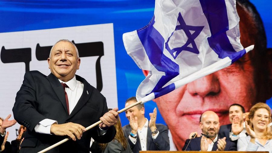 Former military chief Gadi Eisenkot, leader of the Yashar party, waves an Israeli flag following national election exit polls at his party headquarters in Tel Aviv, Israel October 28, 2026.  REUTERS/Shir Torem
