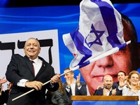 Former military chief Gadi Eisenkot, leader of the Yashar party, waves an Israeli flag following national election exit polls at his party headquarters in Tel Aviv, Israel October 28, 2026.  REUTERS/Shir Torem